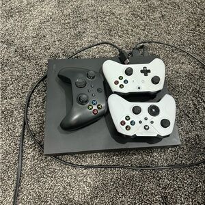 X box one X. In great condition. Used but works perfectly plus 3 controllers